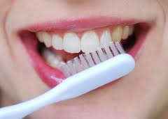 by brushing regularly and as often as you can, you can avoid build up of staining substances.