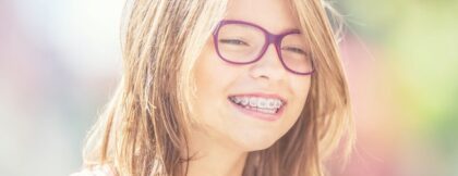 Child with clean braces smiling