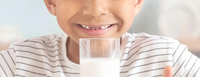 Child smiling with milk