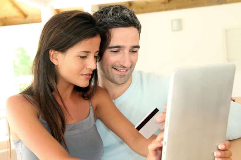 Couple filling out insurance forms online