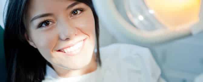 Woman receiving Initial Dental Comprehensive Exam