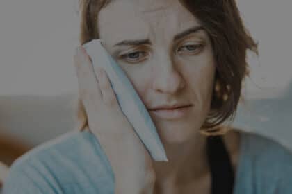 Lady with ice pack on her cheek